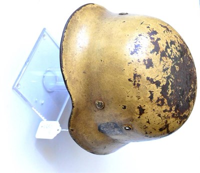 Lot 193 - A German Third Reich M40 Single Decal Helmet, with tan camouflage paint, single Heer eagle...