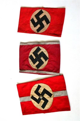 Lot 194 - Three German Third Reich NSDAP Armbands:- one to a Bezirtsleiter, with central silver lace band and