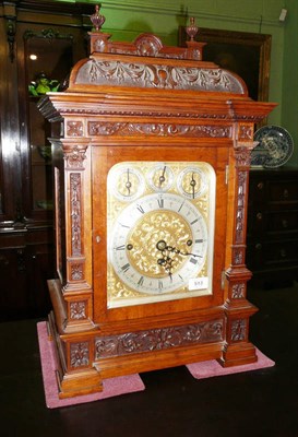 Lot 513 - An Oak Chiming Table Clock, circa 1890, the case with fine carving throughout, caddied top with urn