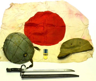 Lot 207 - A Second World War Japanese Combat Helmet, with IJA Star fixed to the front, the six tongued...