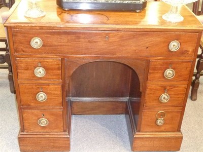 Lot 515 - A Mahogany Kneehole Desk, 19th century and later, the moulded rectangular top above a deep...