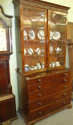 Lot 519 - A Late George III Mahogany Secretaire Bookcase, early 19th century, the ovolo pediment above a...