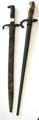 Lot 273 - A German Model 1871 Bayonet, reassembled, and with brass mounted leather scabbard; a French...