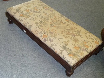 Lot 523 - A Victorian Mahogany Double Footstool, the floral upholstered overstuffed drop-in seat above a...