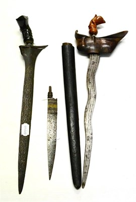 Lot 312 - A Malayan Kris, with 36cm five lok double edge fullered pamor steel blade, flame figured wood...