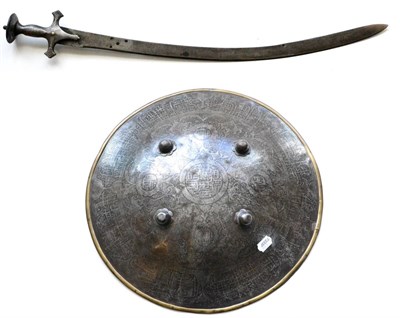 Lot 327 - An 18th/19th Century Indian Steel Dhal, of convex circular form, etched with panels of script, with