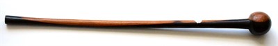 Lot 336 - A Zulu Knobkerrie, with large globular head and tapering cylindrical haft with swollen butt, 79cm