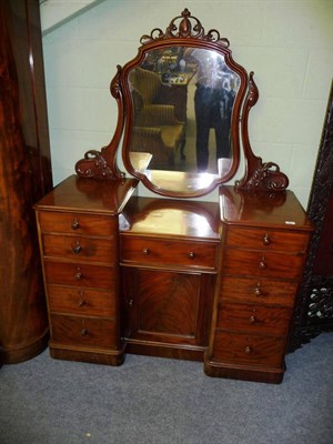 Lot 528 - A Victorian Mahogany Breakfront Dressing Chest, late 19th century, the cartouche shaped swing...