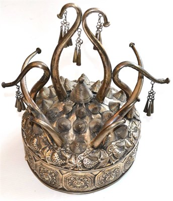 Lot 348 - An Indian Silver Coloured Metal Headdress, of domed circular form, set with embossed panels of...