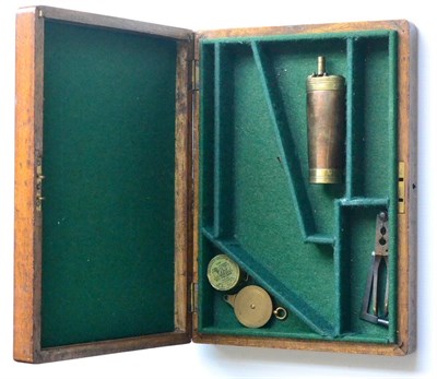 Lot 363 - An Oak Pistol Case, the green baize lined interior fitted with accessories comprising a brass...