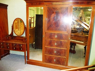 Lot 533 - An Edwardian Mahogany and Boxwood Strung Mirror Door Wardrobe, the moulded pediment above a chequer