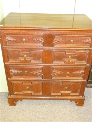 Lot 535 - A Late 17th Century Joined Oak Straight Front Chest of Drawers, the moulded top above two short and