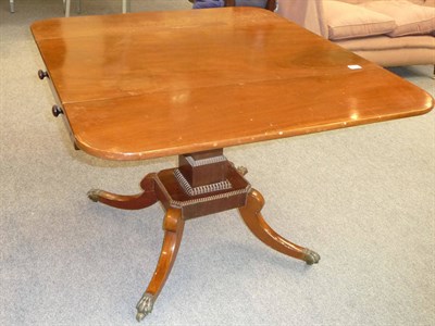 Lot 538 - A Regency Mahogany Sofa Table, 2nd quarter 19th century, the rectangular top with two hinged...