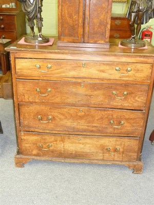 Lot 548 - A George III Elm Straight Front Chest of Drawers, late 18th century, with four long graduated...