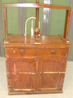 Lot 551 - A Victorian Stained Pine Linen Press, early 19th century, the spiral turned screw mechanism...