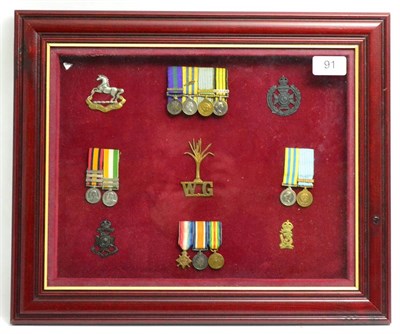 Lot 91 - A Glazed Display of Miniature Medals:- a group of four of General Service Medal with MALAYA...