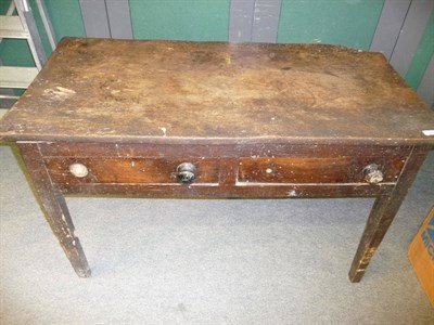 Lot 553 - An Elm Side Table, late 18th century, the rectangular top above two frieze drawers, raised on...