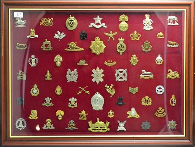 Lot 137 - A Collection of One Hundred and Eighteen Military Cap Badges and Helmet Plates, in brass, white...