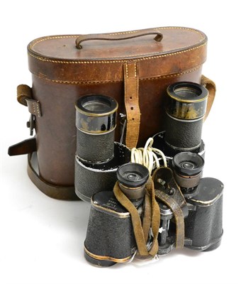 Lot 175 - A Pair of BBT Krauss 8x30 Military Binoculars, with black enamelled frames and leather effect...