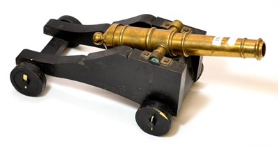 Lot 190 - A Small Non-Working Cannon, the 46.5 cm brass barrel mounted on a black-painted wood carriage