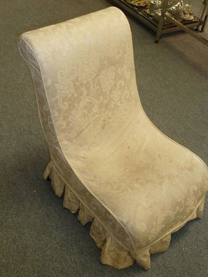 Lot 564 - A Pair of Late 19th Century Ebonised Slipper Shaped Nursing Chairs, with cream floral damask...