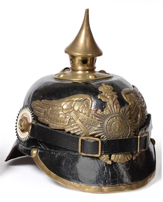 Lot 235 - A Prussian Black Leather Pickelhaube, with stamped brass helmet plate applied with a guard star...