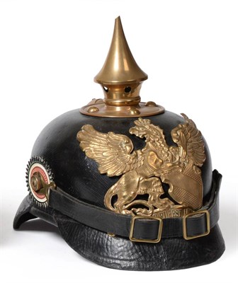 Lot 236 - A Baden Infantry Black Leather Pickelhaube, with pressed brass helmet plate, brass spike and...