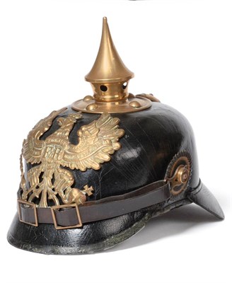 Lot 237 - A Prussian Enlisted Black Leather Pickelhaube, with pressed brass helmet plate, brass spike...