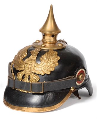 Lot 238 - A Prussian Enlisted Black Leather Pickelhaube, with pressed brass helmet plate, brass spike...