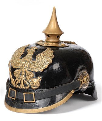 Lot 239 - A Prussian Enlisted Black Patent Leather Pickelhaube, with pressed brass helmet plate, brass...