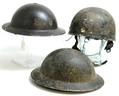 Lot 243 - A British Second World War Mk.II Airborne Helmet, with traces of black paint and later set with...