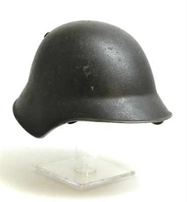 Lot 251 - A Swiss Model 18 Steel Turtle Shaped Military Helmet, painted olive green and with twin vent...