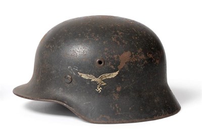 Lot 276 - A German Third Reich Luftwaffe M35 Helmet, with single decal of the Luftwaffe eagle and...