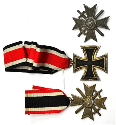 Lot 282 - A German Third Reich Iron Cross, Second Class, the suspender ring stamped with maker's number 44; a