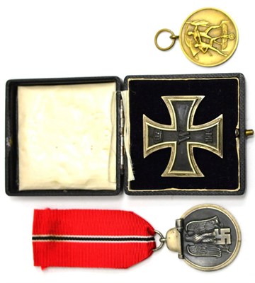 Lot 283 - An Imperial German Iron Cross, First Class, with vertical needle shape pin, cased; a Winter...