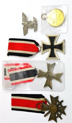 Lot 287 - Five German Third Reich Awards, comprising:- an Iron Cross, second class, the suspender ring...