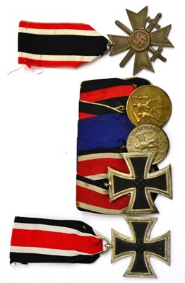 Lot 300 - A German Third Reich Trio, comprising Iron Cross, second class, Armed Forces Long Service Medal...