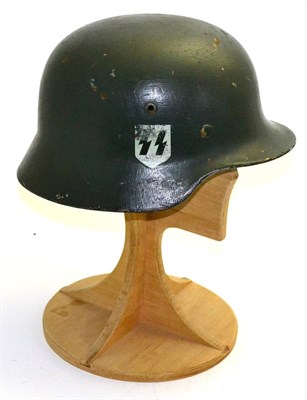 Lot 302 - A German Third Reich M40 SS Double Decal Helmet, with thick green/grey paint, SS runes and...