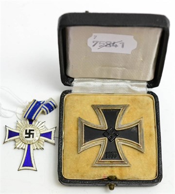 Lot 306 - A Second World War German Third Reich Iron Cross, 1st Class, dated 1939 and with hinged pin to...