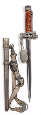 Lot 313 - A German Third Reich Army Dagger, the steel blade with visored helmet W.K.C. Solingen logo, the...