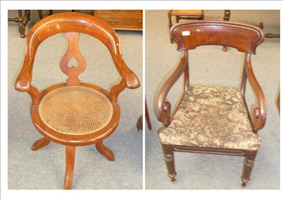 Lot 574 - A Victorian Mahogany and Cane Seated Swivel Chair, the horseshoe back with rounded downswept...