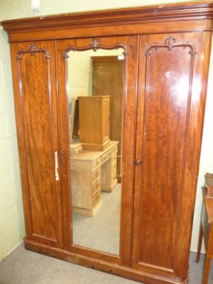 Lot 580 - A Mahogany Triple Door Wardrobe, late 19th century, the moulded  cornice above a plain frieze,...