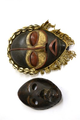 Lot 397 - A Dan (Ivory Coast) Carved Wood Mask, with prominent forehead, circular eyes and protruding...