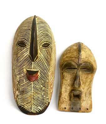 Lot 398 - A Songye (Congo) Carved and Painted Wood Kifwebe Male Mask, of elongated oval form, all over...