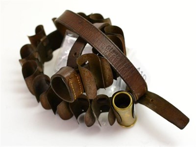 Lot 410 - A Martin's Patent Leather Armband Cartridge Belt, the steel clips stamped with patent number...