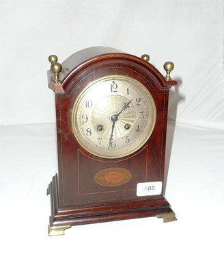 Lot 585 - A Mahogany Arched Mantel Clock, circa 1900, the engine turned silvered dial with black Arabic...