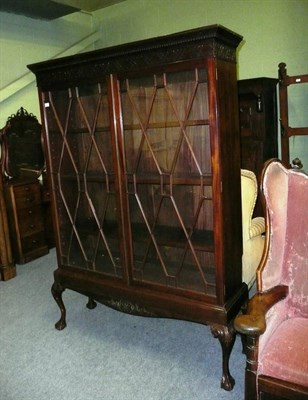 Lot 586 - An Edwardian Mahogany Display Cabinet, the reverse ogee  dentil cornice above a blind fret...