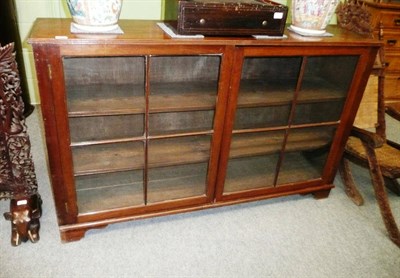 Lot 589 - An Early 20th Century Mahogany Dwarf Bookcase, the reeded edge above two conforming astragal glazed