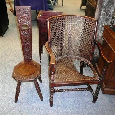 Lot 595 - A 1920's Stained Beech Bergère, the rounded back with wavy shaped arms, turned bobbin...