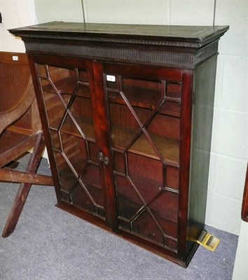 Lot 596 - A George III Mahogany Bookcase Top, circa 1800, the reverse ogee and dentil cornice above a...